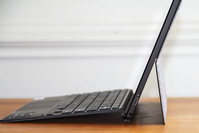 The Asus Chromebook Detachable CM3 seen from the right side, open.