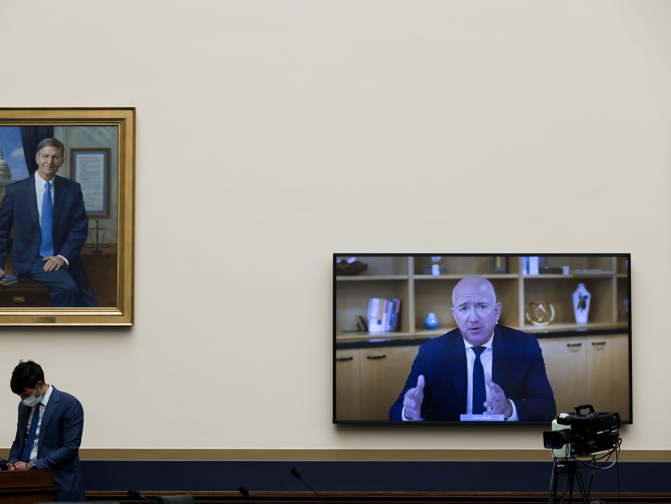 Amazon CEO Jeff Bezos appears on a screen inside the US House of Representatives.