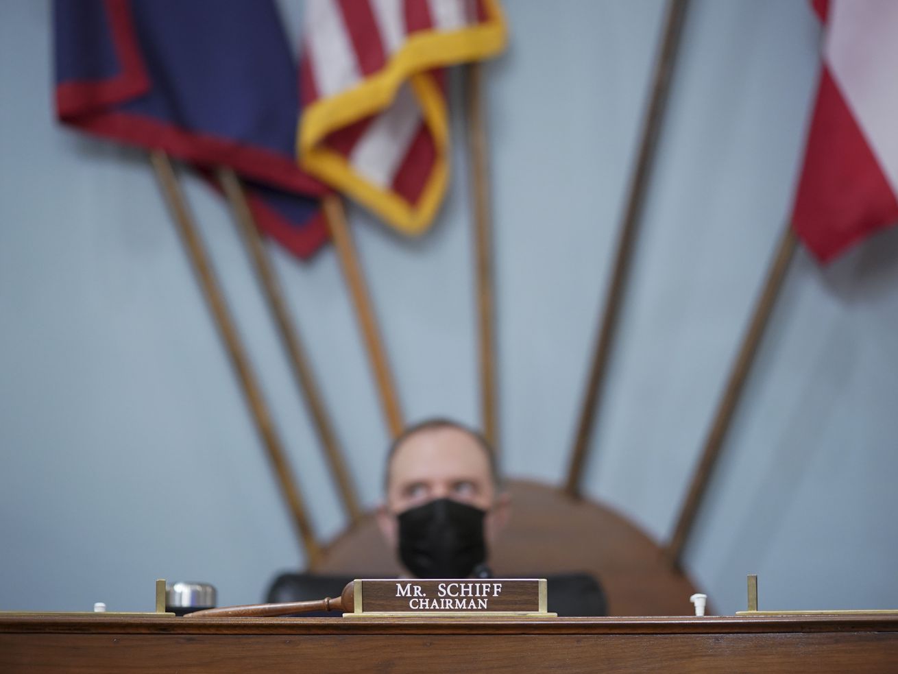 Representative Adam Schiff sits next to a gavel.