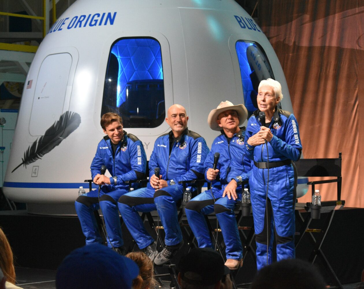 Four spacefliers at post-landing briefing